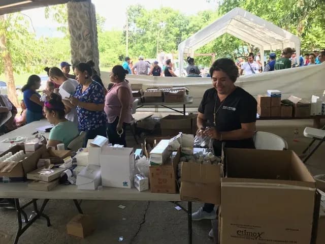 AI placeholder of volunteers organizing humanitarian aid supplies